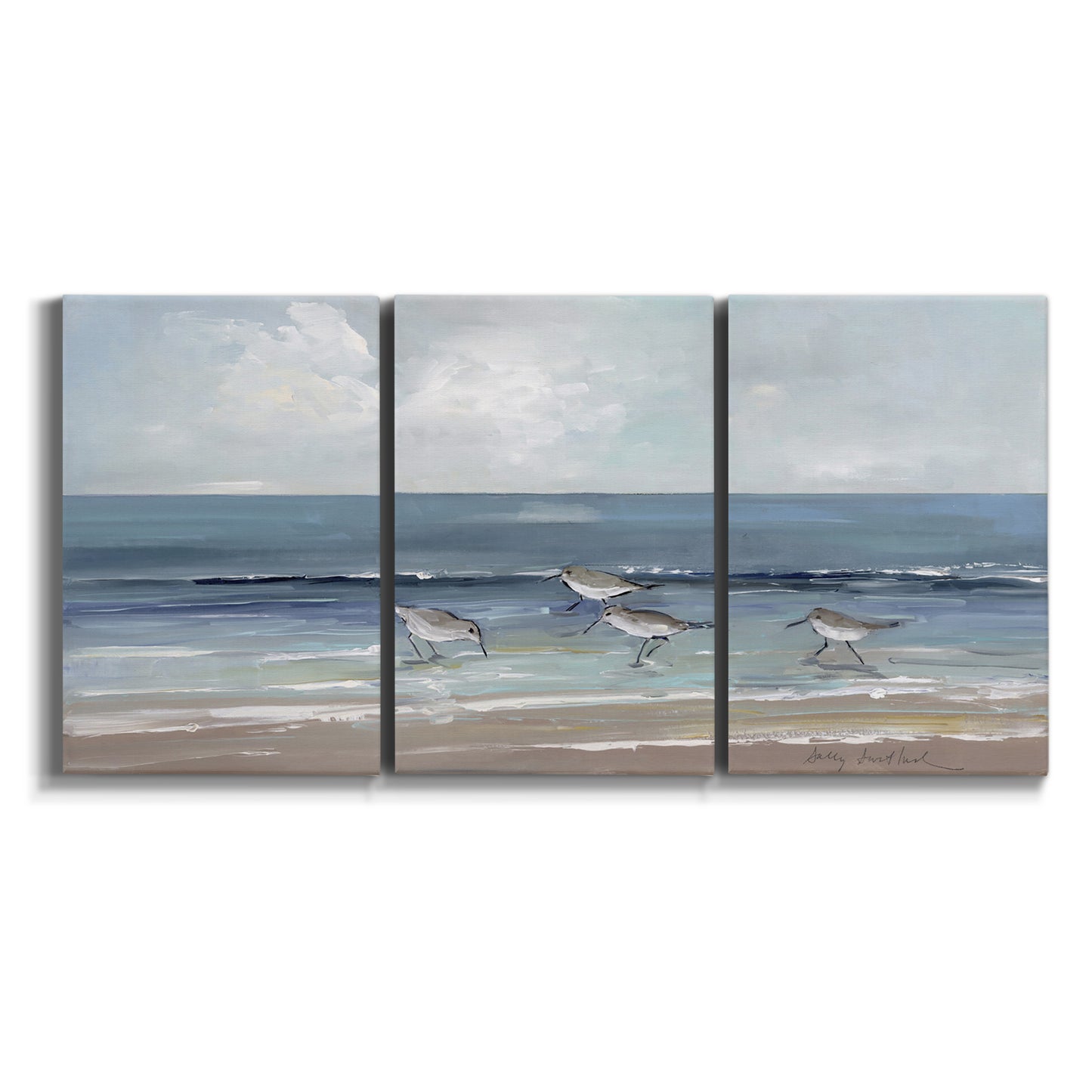 Three-panel canvas wall art featuring shore birds searching along beach on white background.