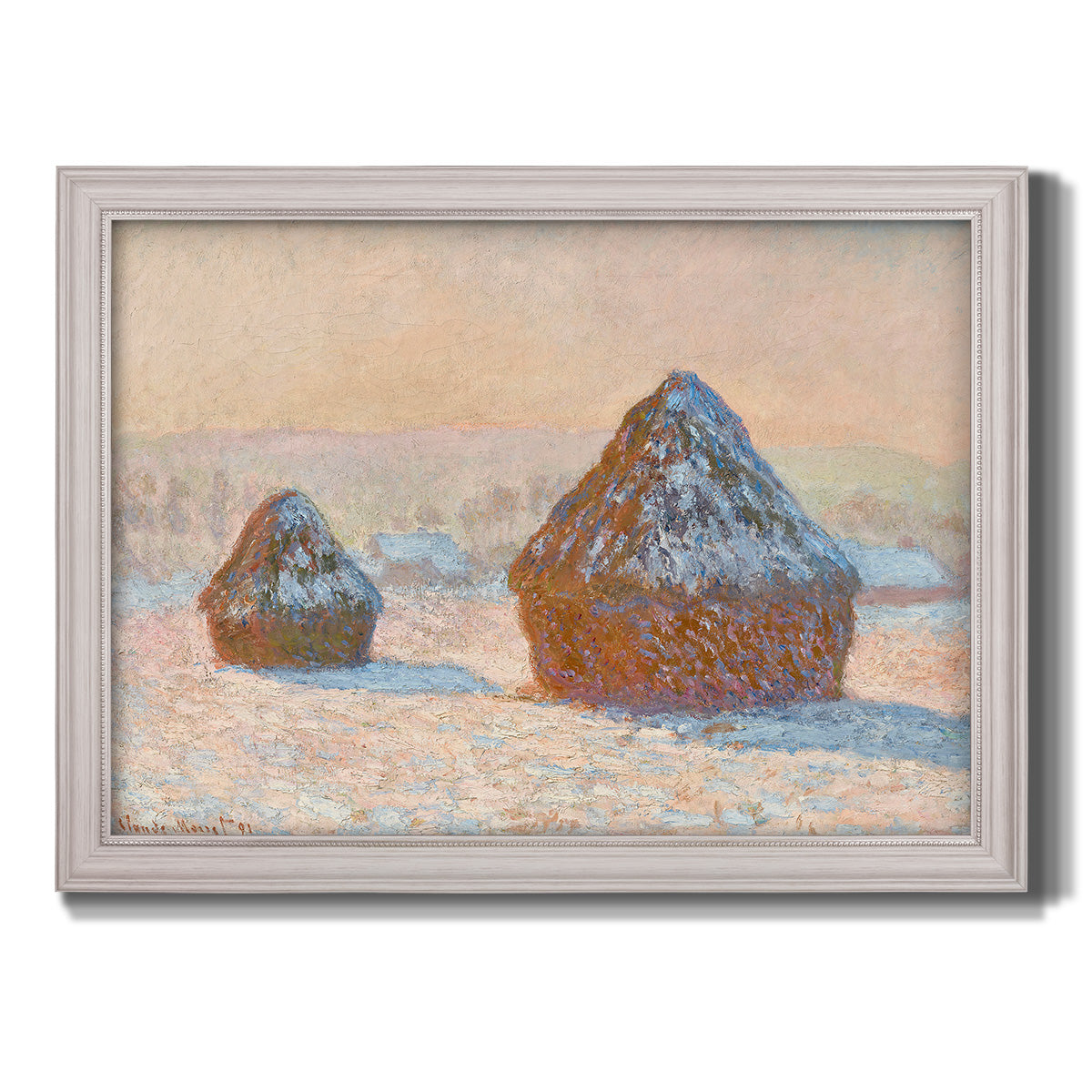 Impressionist winter haystack scene by Claude Monet printed on canvas in an ornate weathered white frame.