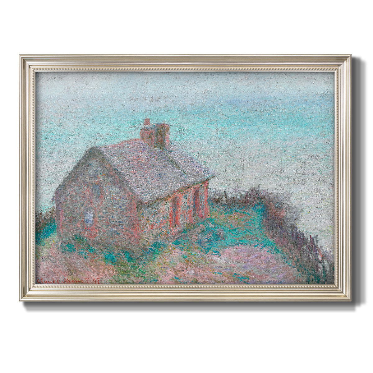 Impressionist coastal building landscape by Claude Monet printed on canvas in an ornate champagne frame.