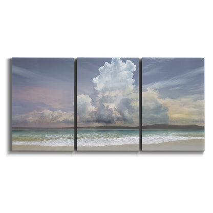 Three-panel canvas wall art featuring rain falling on sandy beach on white background.