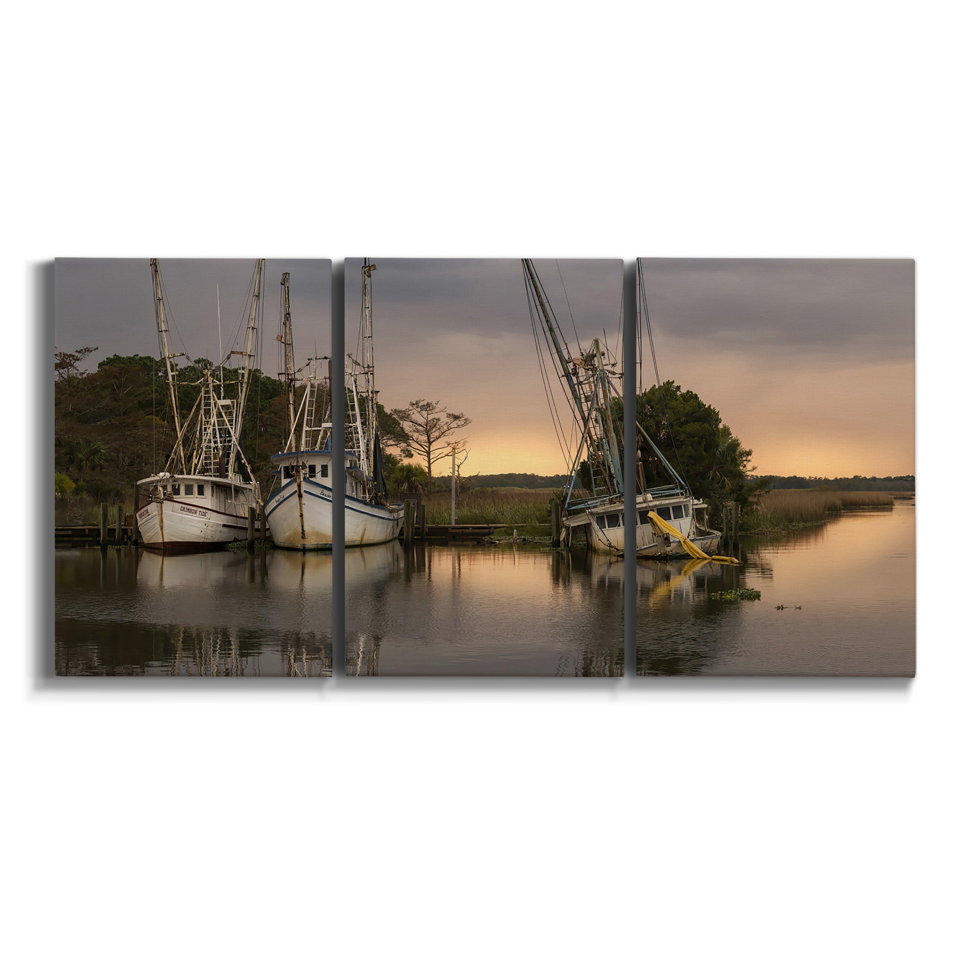 Three-panel canvas wall art featuring fishing trawlers on working harbor on white background.