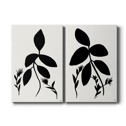 Set of two vertical canvas prints featuring bold black botanical silhouette artwork, displayed side by side.
