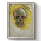 Expressive skull study painting by Vincent van Gogh printed on canvas in an ornate black frame with gilded inner detail with a vertical orientation.