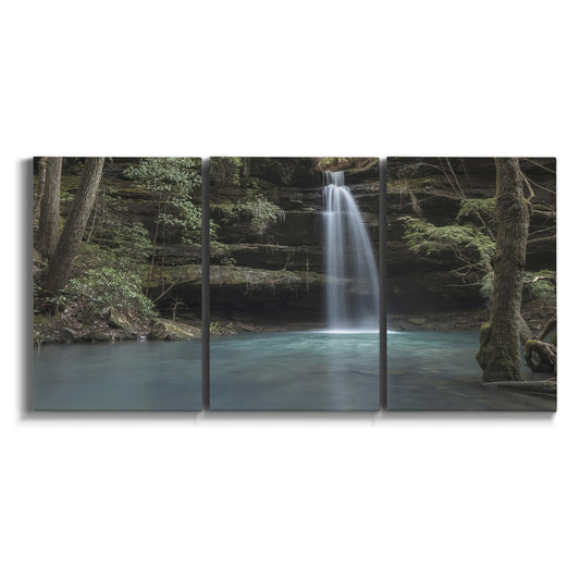 Three-panel canvas wall art featuring waterfall cascading through forest on white background.