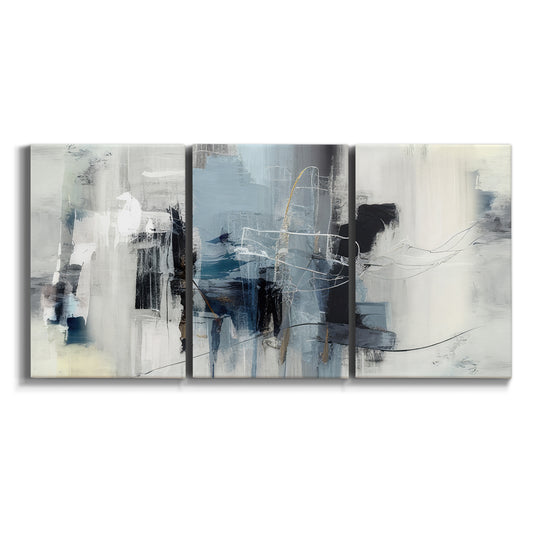 Three-panel canvas wall art featuring cool abstract winter color wash on white background.