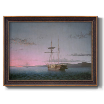 Coastal nautical scene with schooners at dusk by Fitz Henry Lane printed on canvas in an ornate bronzed mahogany wood frame.