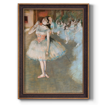 Impressionist ballet dancer scene by Edgar Degas printed on canvas in an ornate weathered white frame with a vertical orientation.