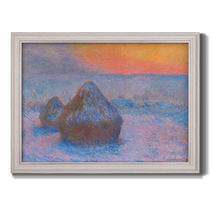 Impressionist haystack scene at sunset by Claude Monet printed on canvas in an ornate weathered white frame.