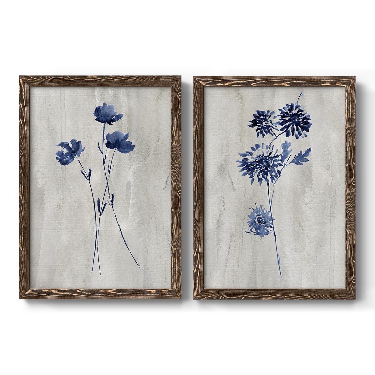 Set of two walnut barnwood framed canvas prints featuring two rustic monochrome botanical paintings featuring blue wildflower stems on weathered neutral paper.