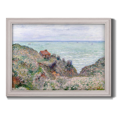 Impressionist coastal watch cabin scene by Claude Monet printed on canvas in an ornate weathered white frame.