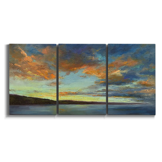 Three-panel canvas wall art featuring coastal shoreline at golden hour on white background.