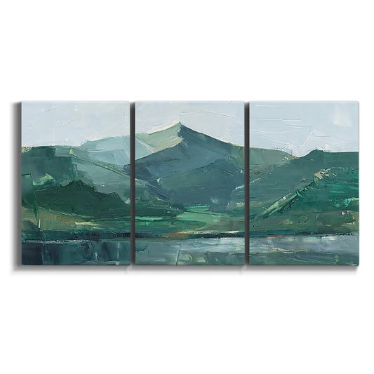 Three-panel canvas wall art featuring muted mountain range in grey tones on white background.