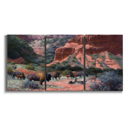 Three-panel canvas wall art featuring rugged canyon landscape with wildlife on white background.