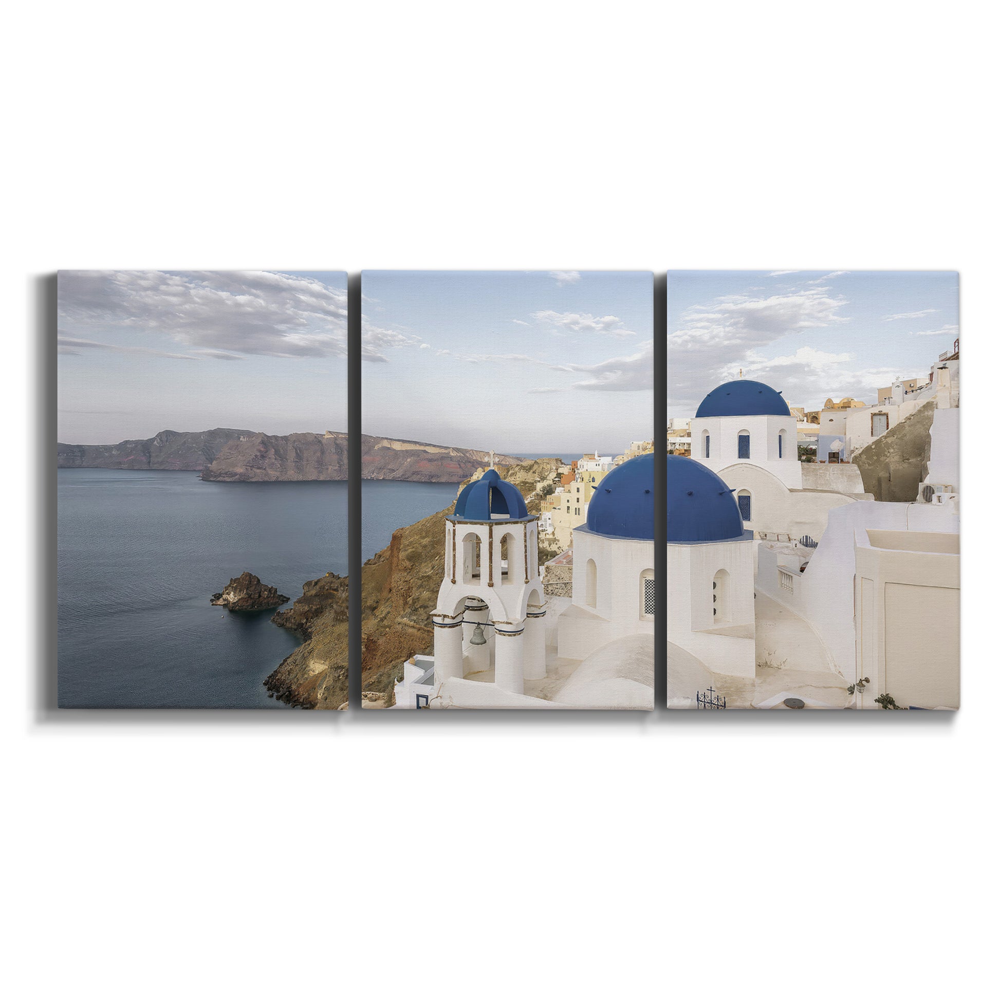 Three-panel canvas wall art featuring white buildings overlooking sea cliffs on white background.