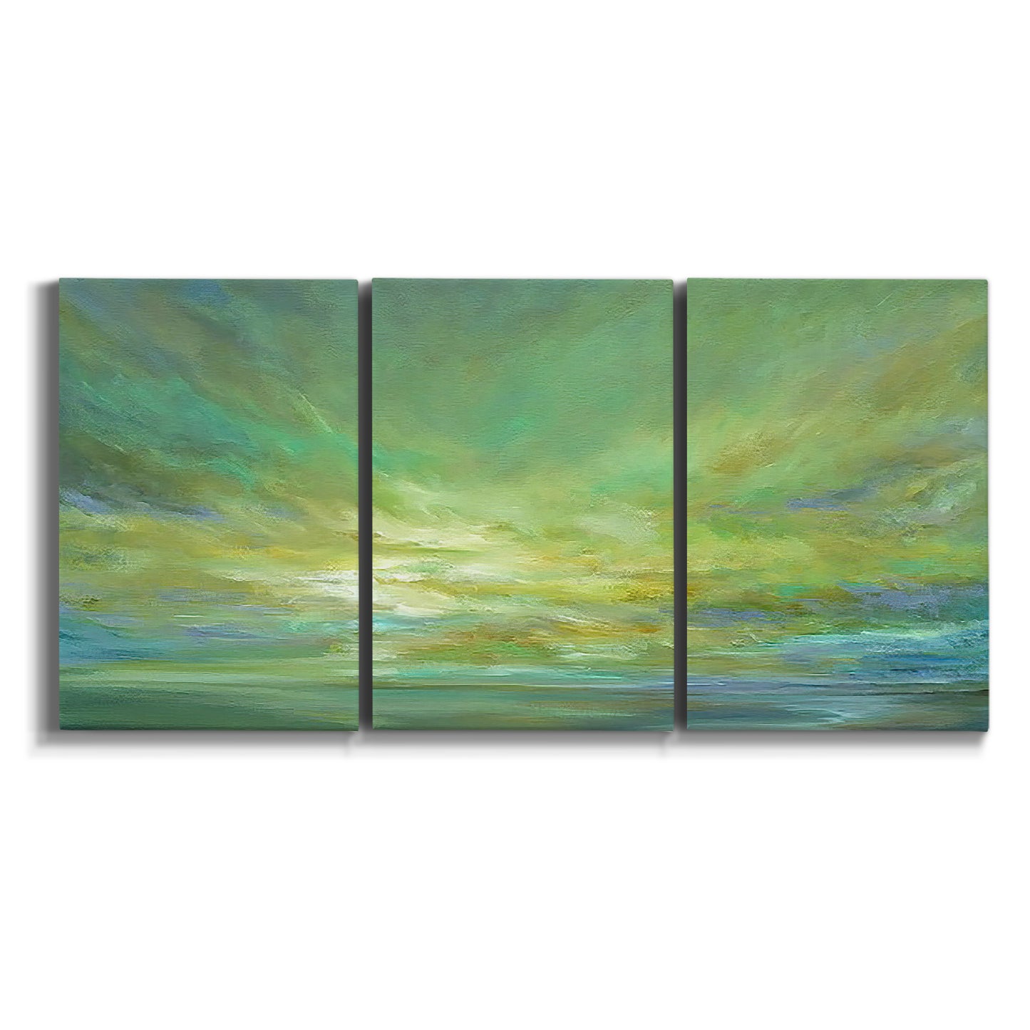 Three-panel canvas wall art featuring coastal shoreline under open sky on white background.