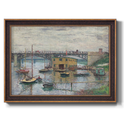 Impressionist river bridge scene on an overcast day by Claude Monet printed on canvas in an ornate bronzed mahogany wood frame.