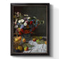 Impressionist floral still life painting by Claude Monet printed on canvas in an ornate black frame with gilded inner detail with a vertical orientation.