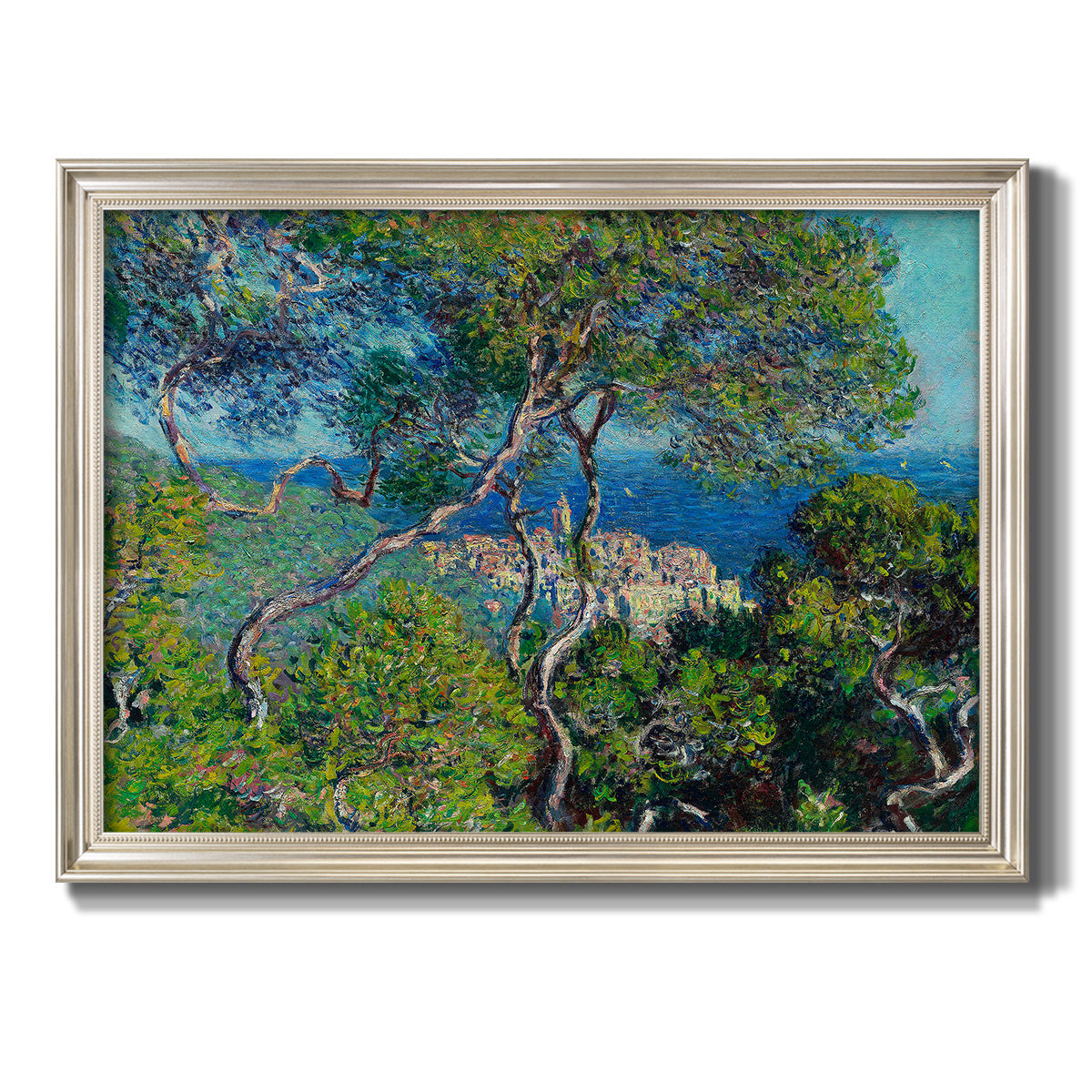 Impressionist Mediterranean coastal landscape by Claude Monet printed on canvas in an ornate champagne frame.