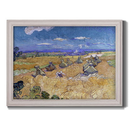 Impressionist wheat harvest scene by Vincent van Gogh printed on canvas in an ornate weathered white frame.