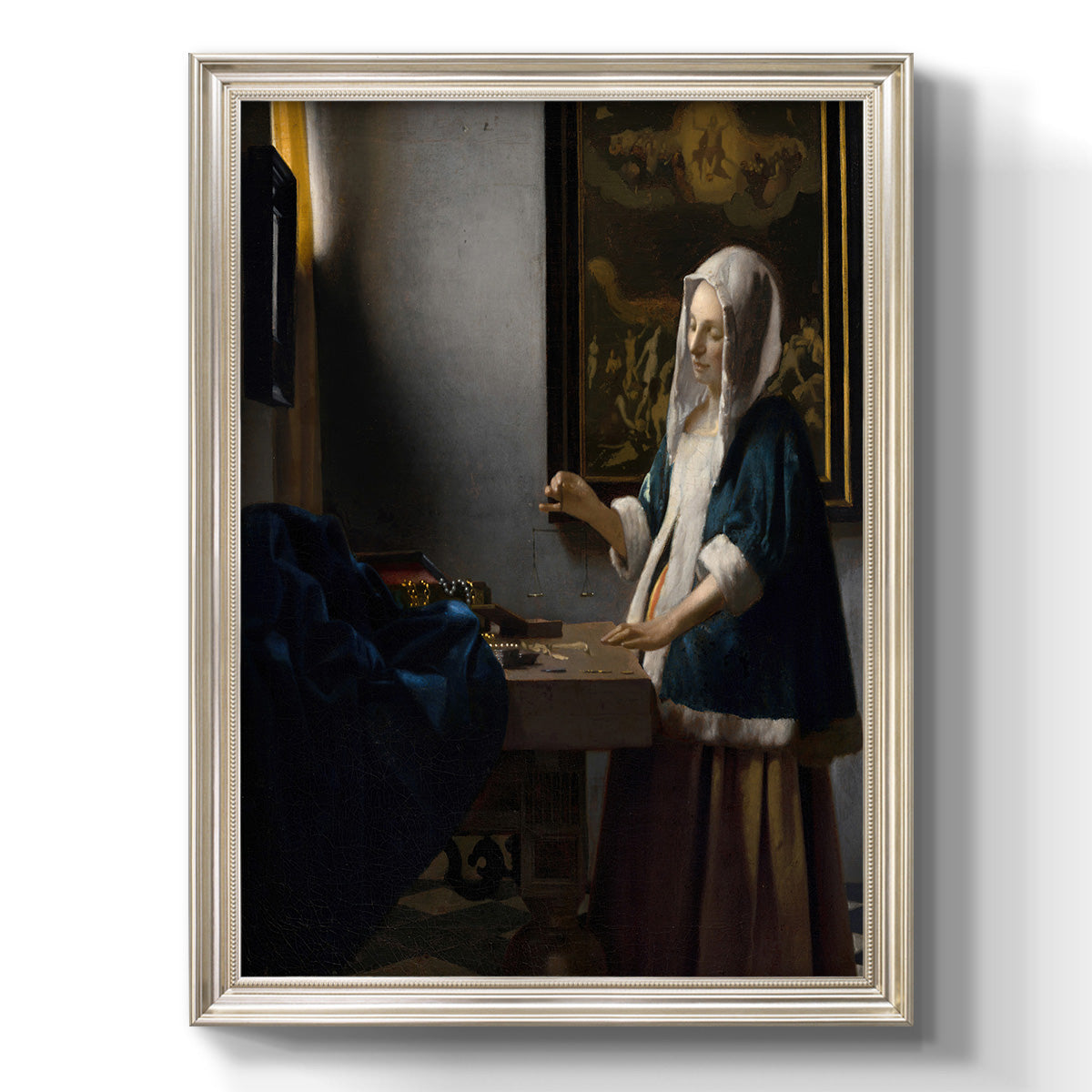 Quiet interior genre scene of a woman with scales by Johannes Vermeer printed on canvas in an ornate champagne frame with a vertical orientation.