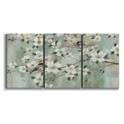 Three-panel canvas wall art featuring delicate spring blossoms with birds on white background.