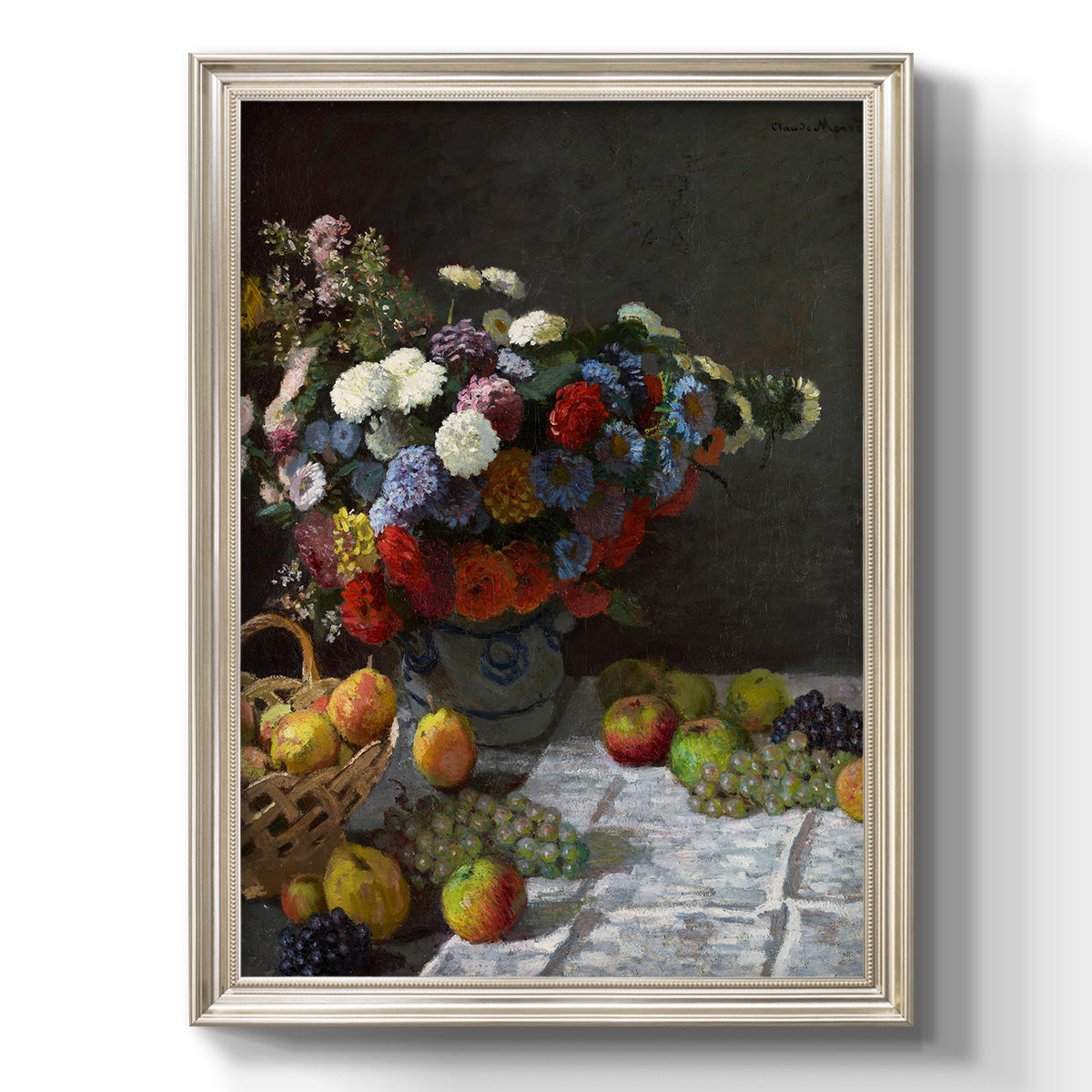 Impressionist floral still life painting by Claude Monet printed on canvas in an ornate champagne frame with a vertical orientation.
