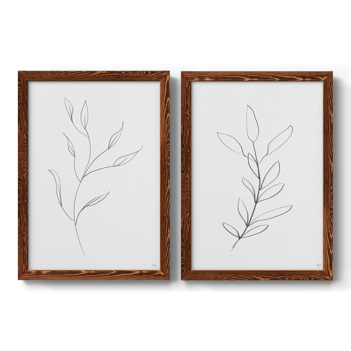 Set of two maple barnwood framed canvas prints featuring two minimalist botanical line drawings featuring single continuous-line leafy branches.