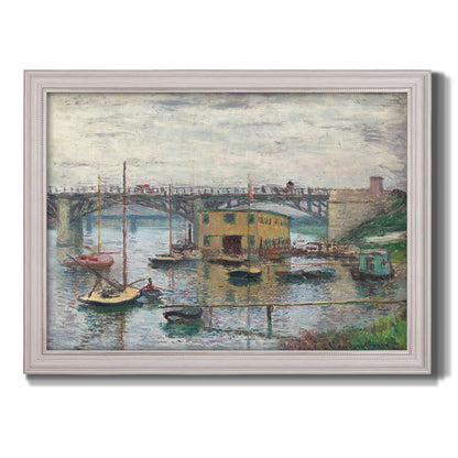 Impressionist river bridge scene on an overcast day by Claude Monet printed on canvas in an ornate weathered white frame.