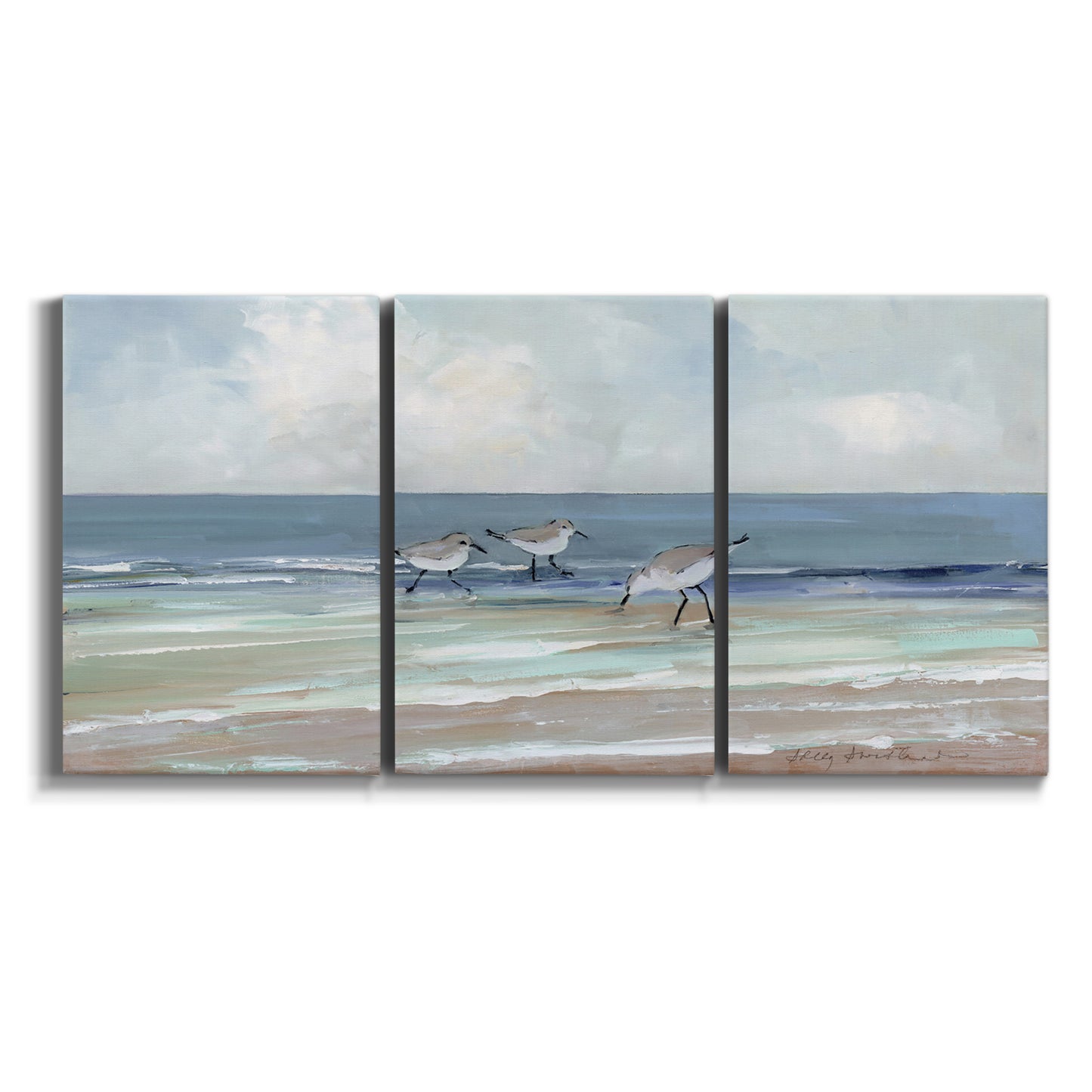 Three-panel canvas wall art featuring shore birds searching along beach on white background.