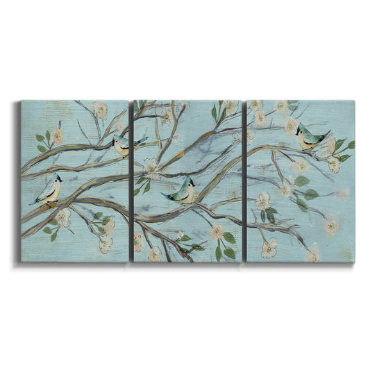 Three-panel canvas wall art featuring blue sky with flowering branches on white background.