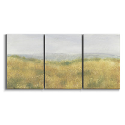Three-panel canvas wall art featuring pastoral wheat field landscape on white background.