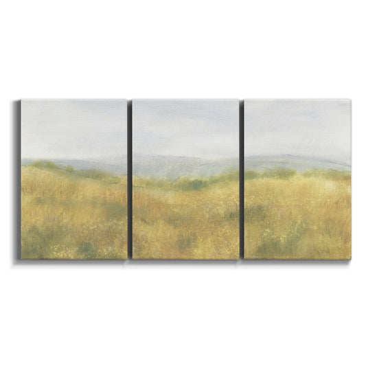 Three-panel canvas wall art featuring pastoral wheat field landscape on white background.
