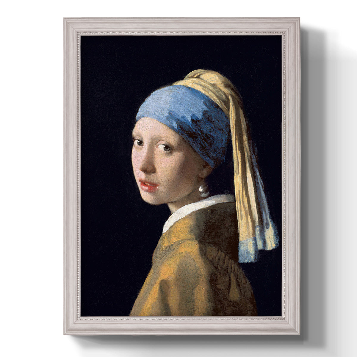 Iconic portrait of a girl wearing a pearl earring by Johannes Vermeer printed on canvas in an ornate champagne frame with a vertical orientation.