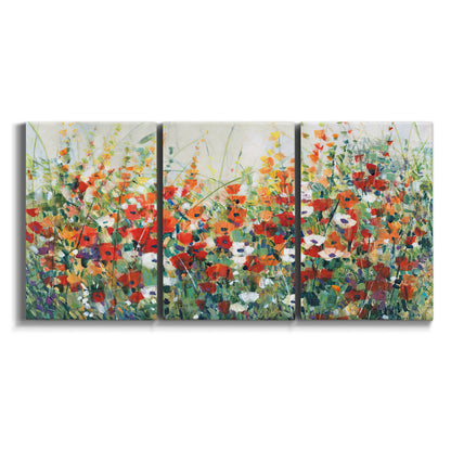 Three-panel canvas wall art featuring colorful garden flowers in bloom on white background.