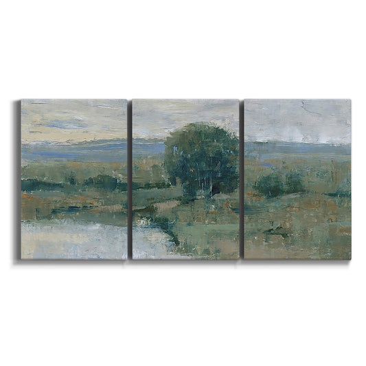 Three-panel canvas wall art featuring riverbank landscape with reflections on white background.