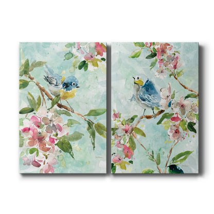 Set of two vertical canvas prints featuring colorful garden birds and floral botanical artwork, displayed side by side.
