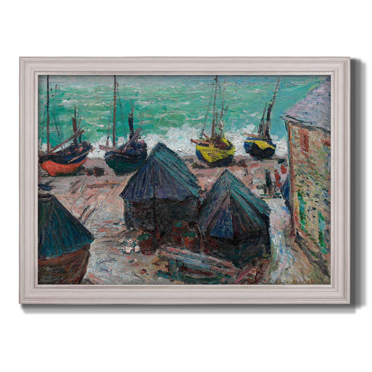 Impressionist coastal beach scene with boats by Claude Monet printed on canvas in an ornate weathered white frame.