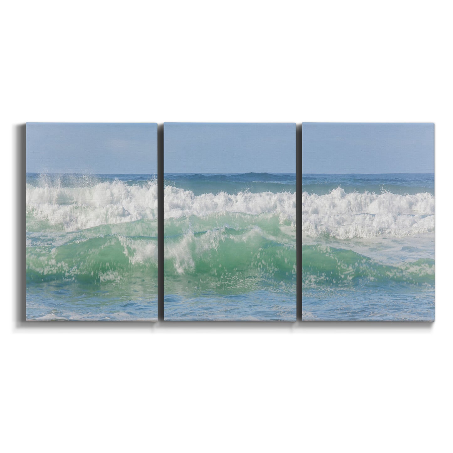 Three-panel canvas wall art featuring coastal waves breaking ashore on white background.