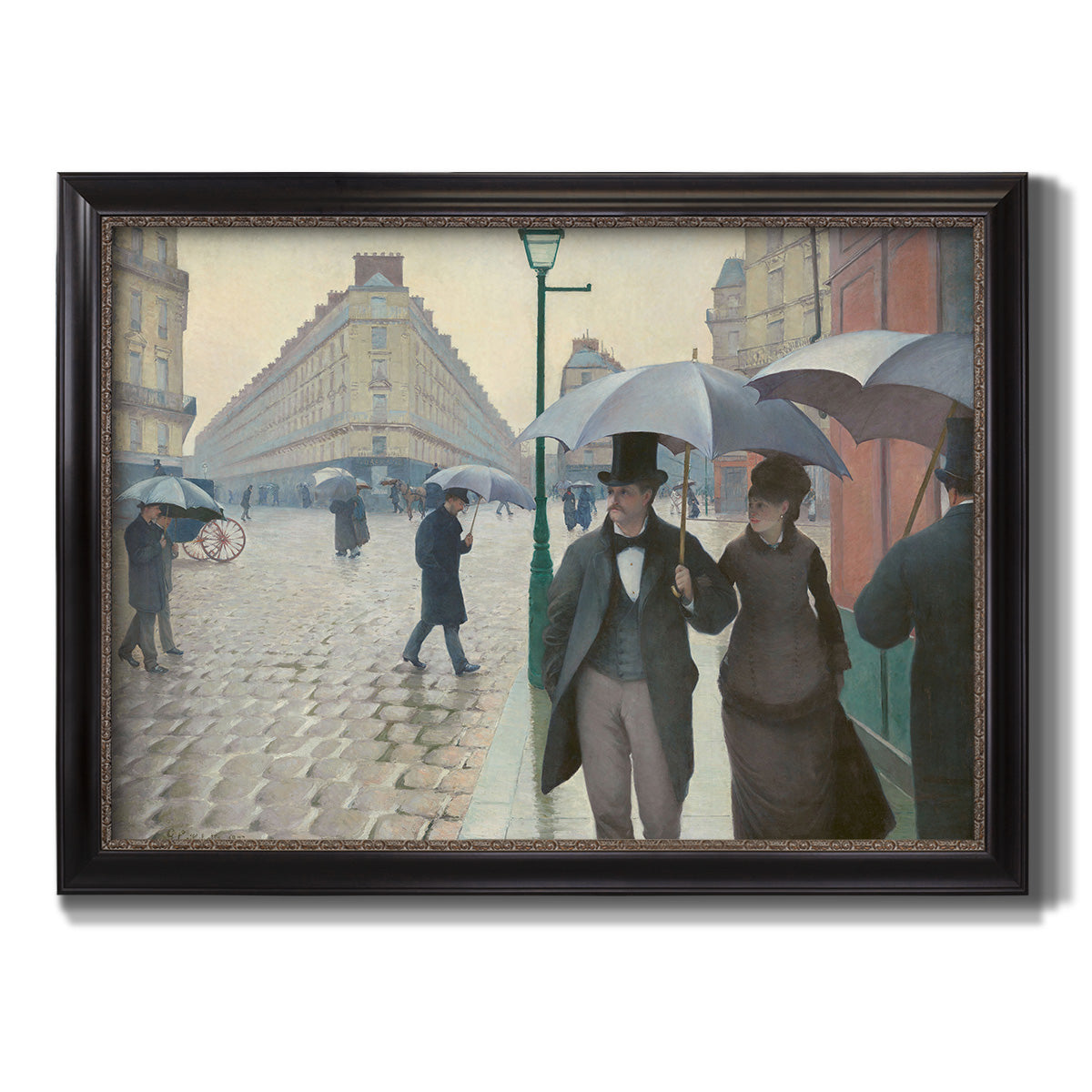 Impressionist urban street scene in the rain by Gustave Caillebotte printed on canvas in an ornate black frame with gilded inner detail.