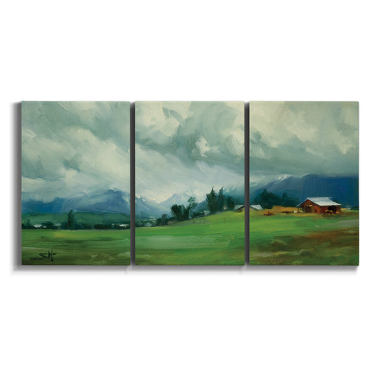 Three-panel canvas wall art featuring wide pastoral valley landscape on white background.