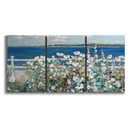 Three-panel canvas wall art featuring coastal garden overlooking bay on white background.