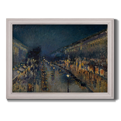 Impressionist nighttime Paris street scene by Camille Pissarro printed on canvas in an ornate weathered white frame.