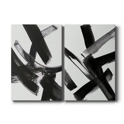 Set of two vertical canvas prints featuring bold black and white abstract geometric artwork, displayed side by side.