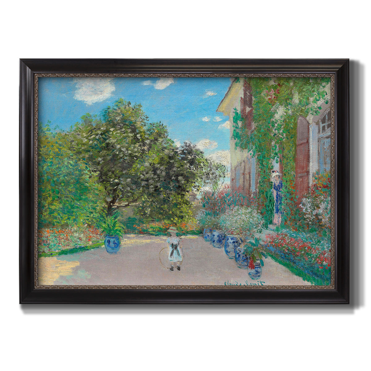 Impressionist residential landscape at Argenteuil by Claude Monet printed on canvas in an ornate black frame with gilded inner detail.