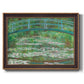 Impressionist garden scene with Japanese bridge and water lilies by Claude Monet printed on canvas in an ornate bronzed mahogany wood frame.