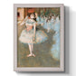 Impressionist ballet dancer scene by Edgar Degas printed on canvas in an ornate champagne frame with a vertical orientation.