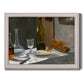 Impressionist still life with wine and bread by Claude Monet printed on canvas in an ornate weathered white frame.