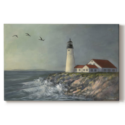 Lighthouse stands tall against crashing waves at a coastal location with birds flying overhead during a calm day