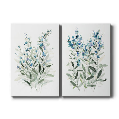 Set of two vertical canvas prints featuring delicate blue botanical floral illustrations, displayed side by side.