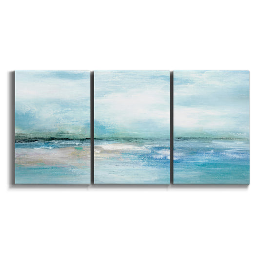 Three-panel canvas wall art featuring sunset silhouette over coastal water on white background.